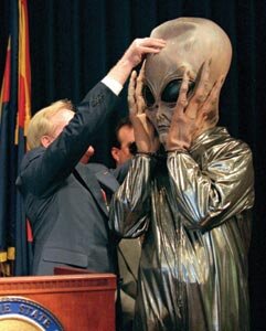 Symington_Removing_Alien_Mask.jpg